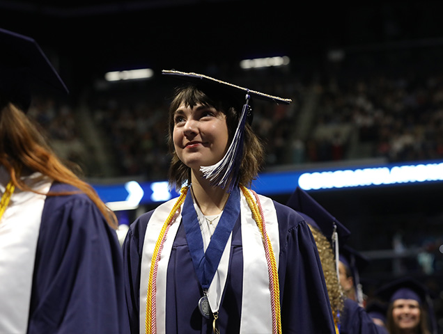 Student graduating with an MBA 