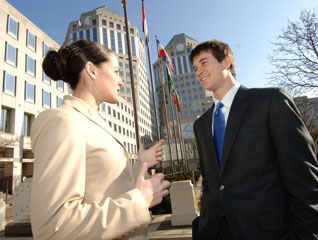 Student in the part-time MBA program speaking with another student