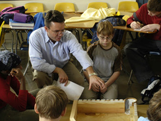 Student in the Masters of Educational Administration program working with children