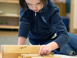 A child in the Montessori Lab school playing
