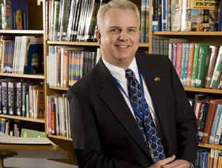 Student in the Master of Education in Reading program in a library