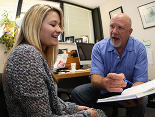 Med Special Education student meeting with a professor