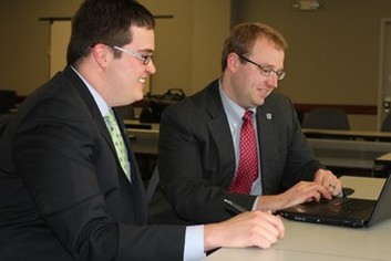 Students Looking at a Computer photo