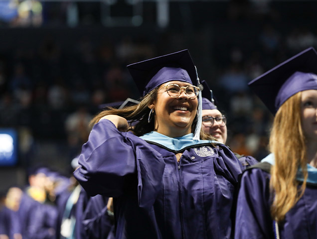 Student at graduating with a MHSA and MBA at graduation 