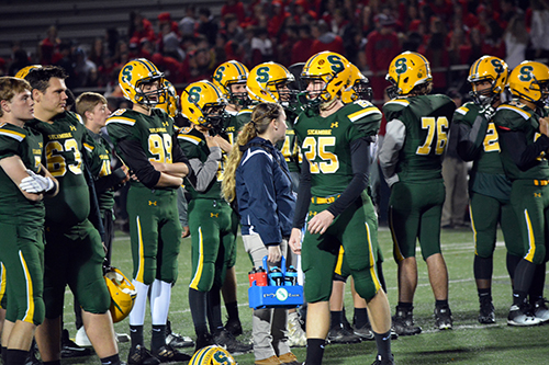 Photo of Lexie Eggert with Football team