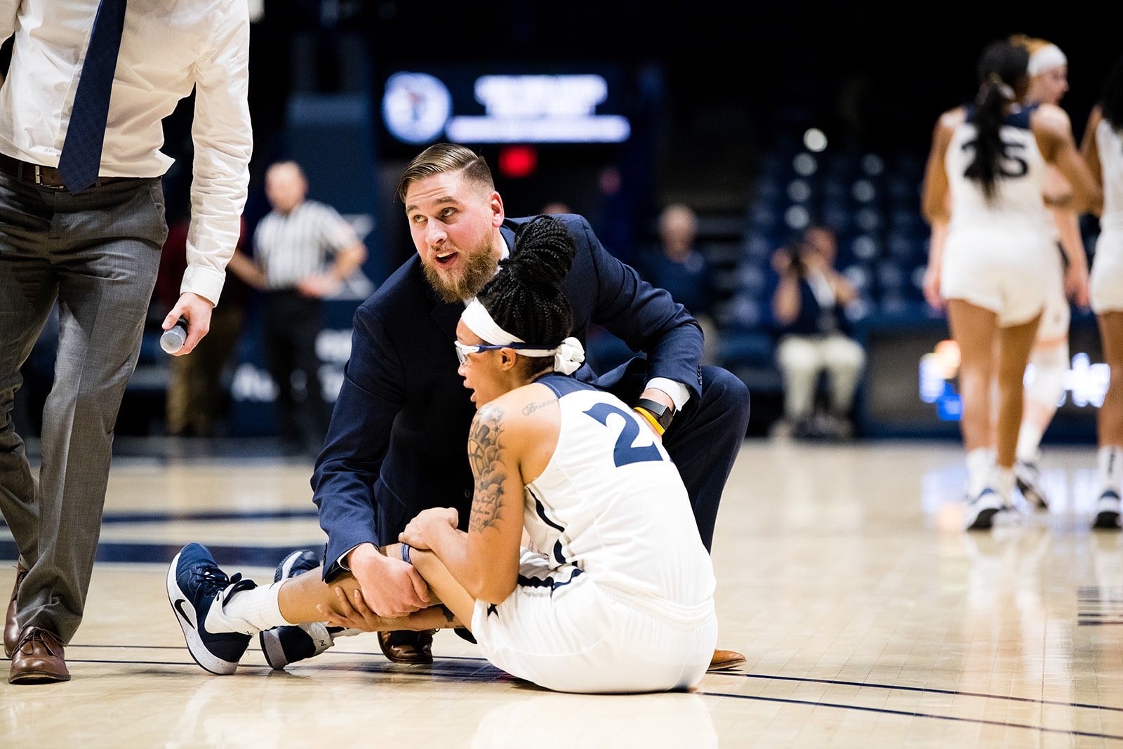 Photo of Connor Barnes helping an Athlete