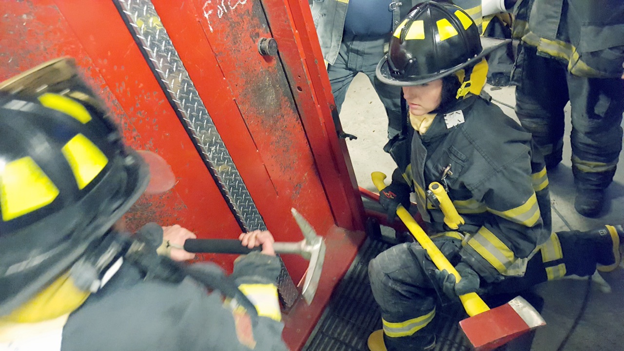 Photo of Maura Shea helping Firefighters