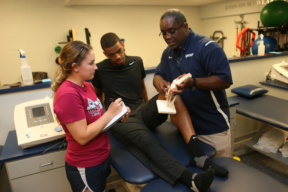 Head Athletic Trainer, Dave Fluker providing patient education.