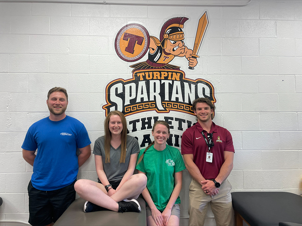 Kassidy & Katie (MSAT students), Steven Kinser & Michael Huber, Athletic Trainers at Turpin High School.