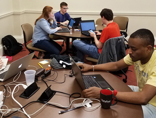 Students in the mathematics major researching together on computers