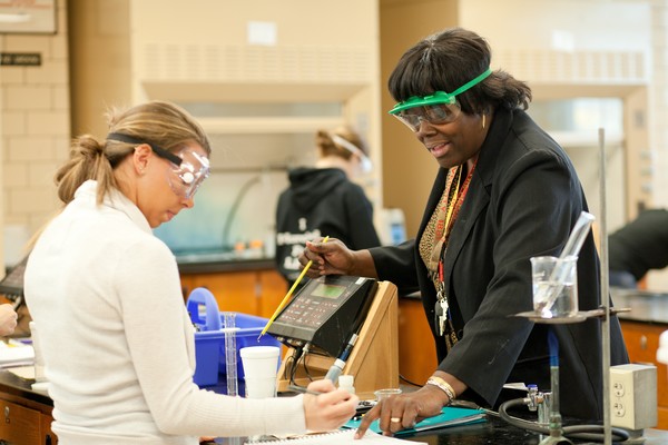 Photo of XU Student and Professor doing Lab Work