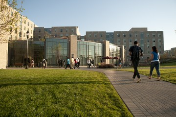 The exterior of Justice Hall on a sunny summer afternoon.