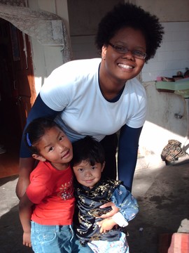 Photo of XU Student Volunteer working with Children