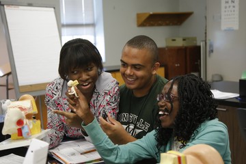 Photo of XU Student and Faculty working on a Lab