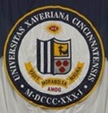 The Xavier University Seal. Text on the seal reads: Universitas Xaveriana Cincinnatensis, M DCC XX I