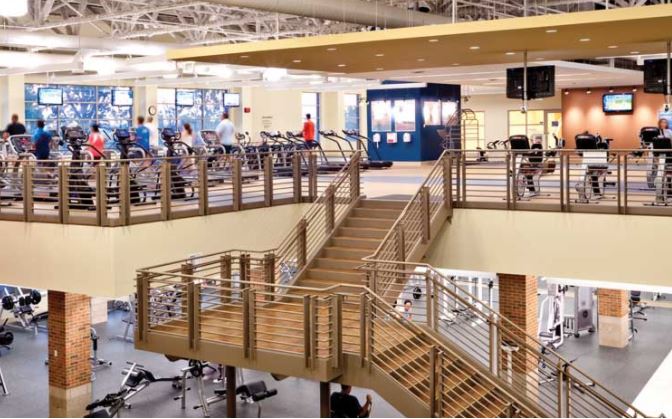 Students exercising and using gym equipment