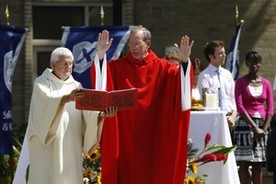 Father Graham leading a Sunday Mass