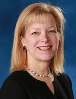 Portrait of Dr. Pam Zarkowski. She is wearing a black shirt.
