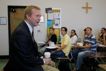 Professor teaching and lecturing students in a classroom