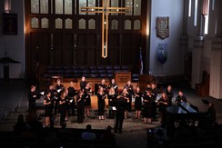 The Xavier University Chorus singing inside a chapel