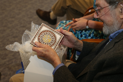 Photo of Fr. George Traub receiving a gift