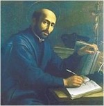 Ignatius writing at his desk