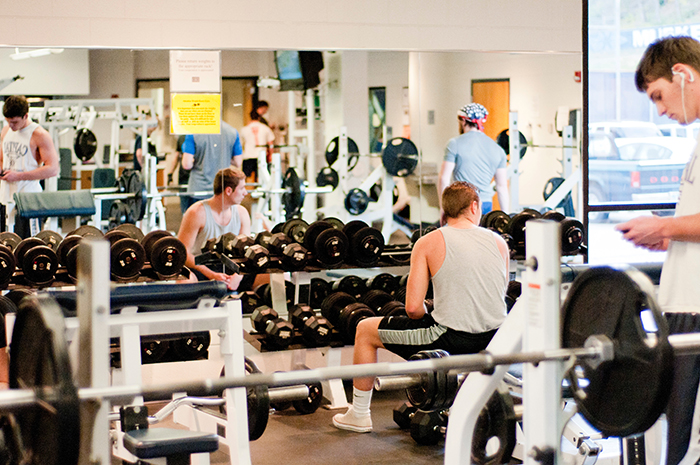 Male using weights in OConnor Sports Center 