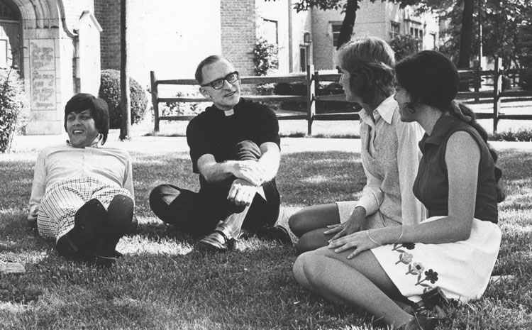 Fr. Kennealy with students outside