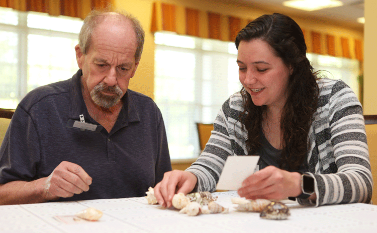 Photo of Natalie and a man at a table