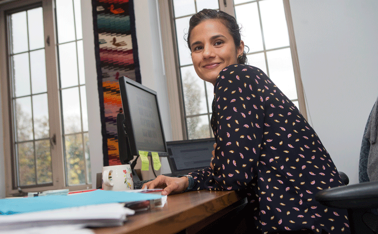 Photo of Stacey Raj working on her Laptop