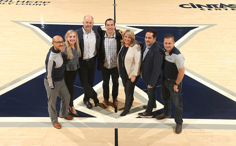 Photo of EMBA Students inside the Cintas Arena