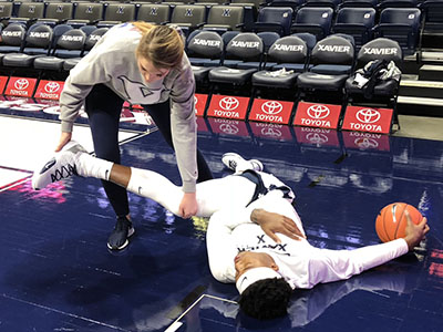 Tori stretches a player.