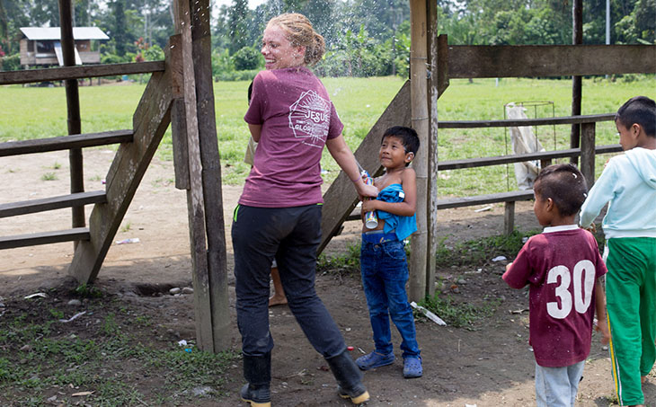 Photo of Kellie Goff playing with children