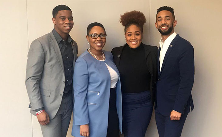 Photo of Dr. Kyra Shahid with the Student Government Executive team, President Blair McKee ('20), Vice President Alfredo Mercedes ('20), and Vice President Desmond Varner ('21) 