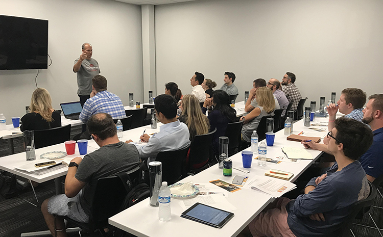 Photo of Professor giving his Class of Students a Lecture