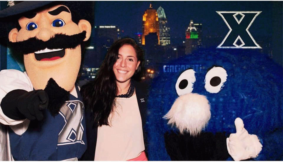 Photo of Angela Sims with XU mascots