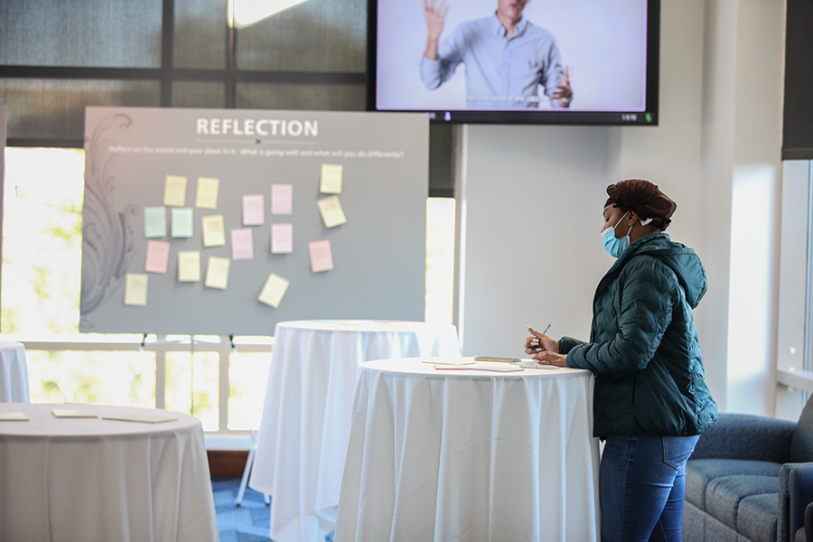 Photo of Student writing Post-It notes inside GSC