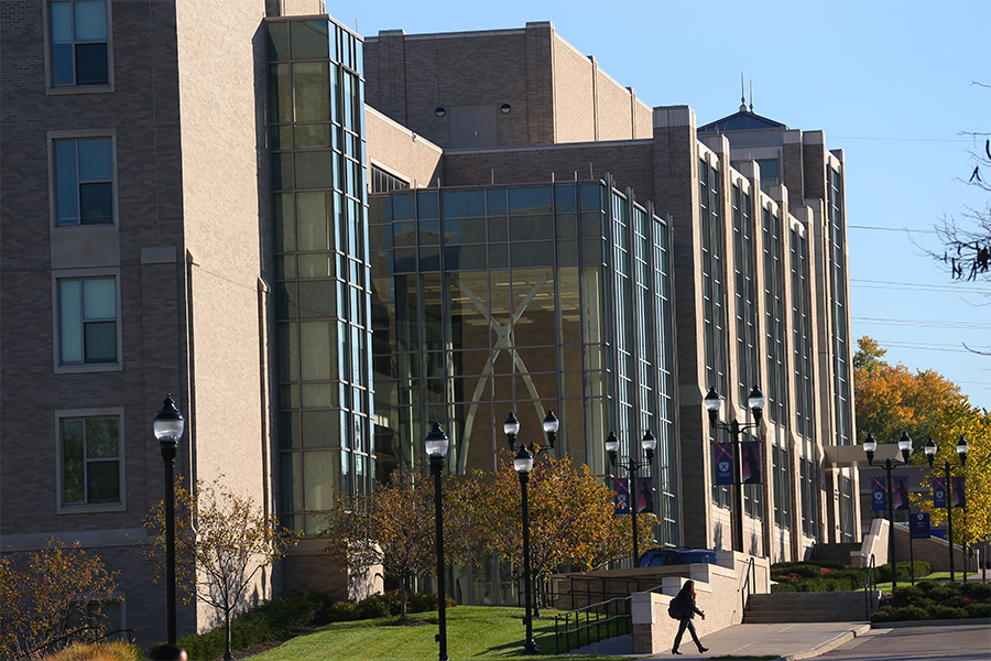 A wide shot shows the Williams College of Business on Xavier University's campus during a sunny day.