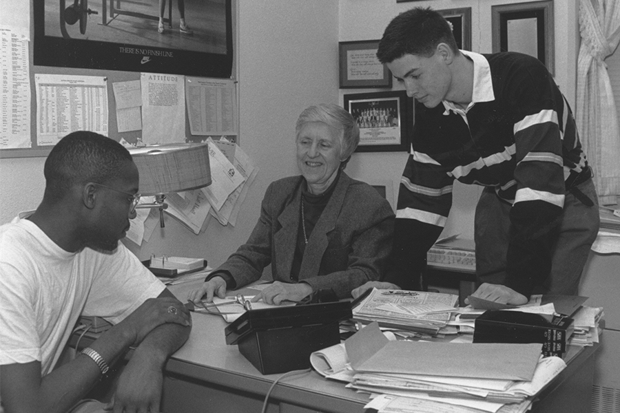 Sr. Fleming meeting with two students