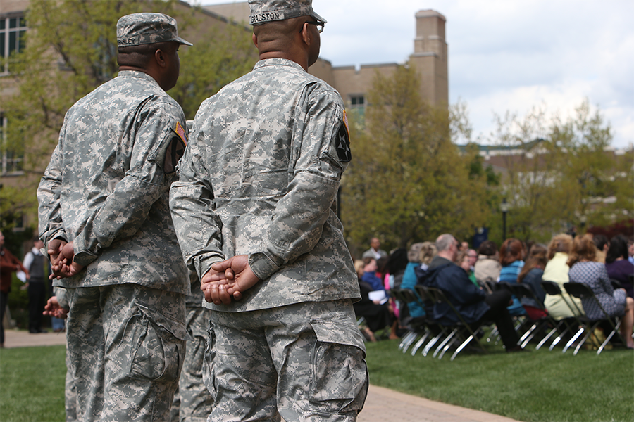 Two individuals in their military uniforms on Xavier's campus