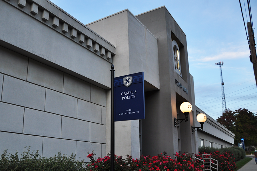 A sign that reads, Campus Police, stands in front of Flynn Hall, the building that houses the Xavier University Police Department