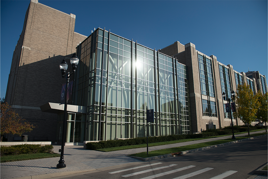 Photo of the exterior of Smith Hall, home to the Williams College of Business, on a Sunny Day