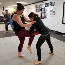 A physical self-defense workshop held at the Thrive Empowerment Center