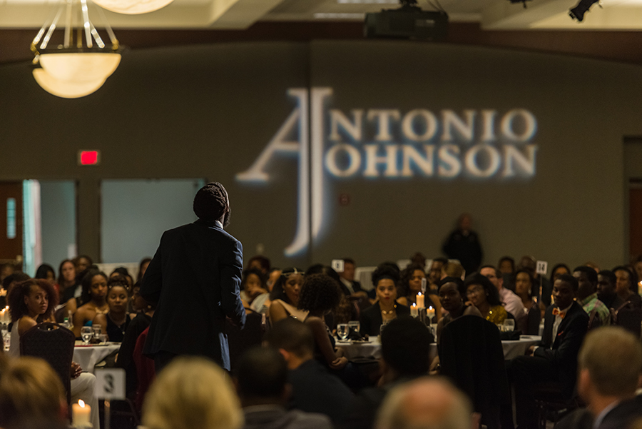 Groups of students, alum and members of the Xavier and Cincinnati community sitting at tables during a past Antonio Johnson Scholarship Gala 