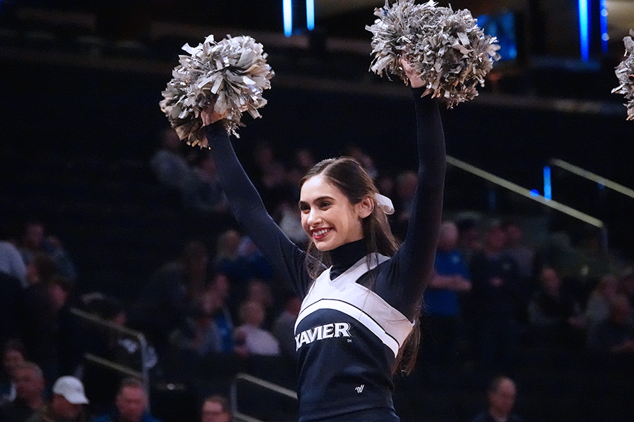 Xavier Cheerleader Jaylen Loza performs with her team during a BIG EAST Men's Basketball Tournament Game in Madison Square Garden.