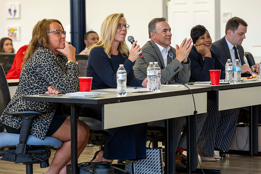 five judges sitting behind a table during the competition