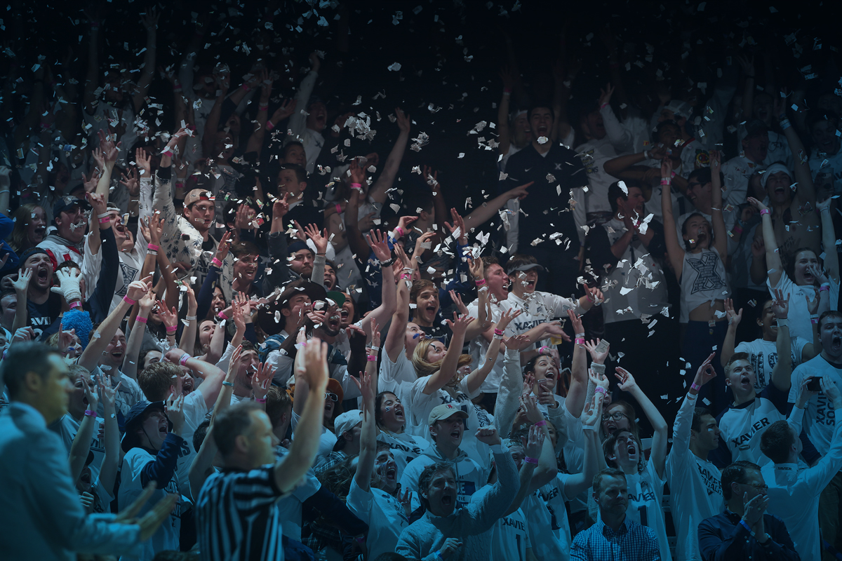 Xavier students cheer at a Musketeer basketball game