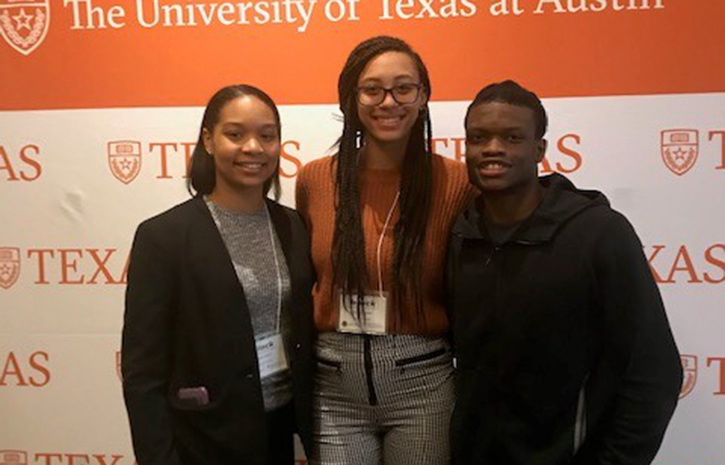 Group Photo of Three Black Students with an Athlete
