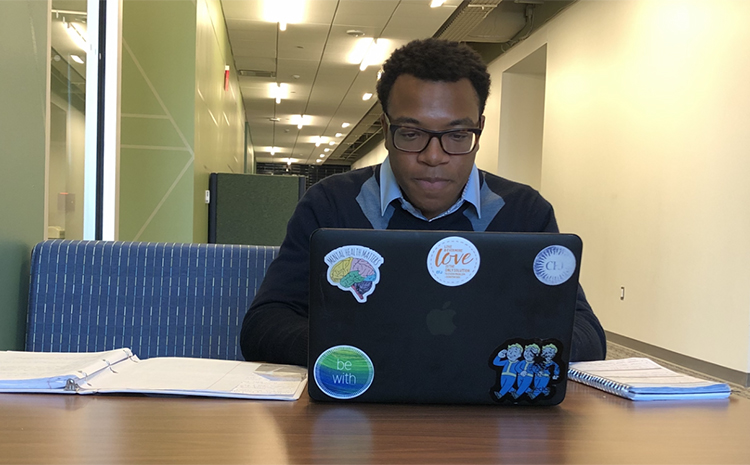 Photo of Student working on their Laptop