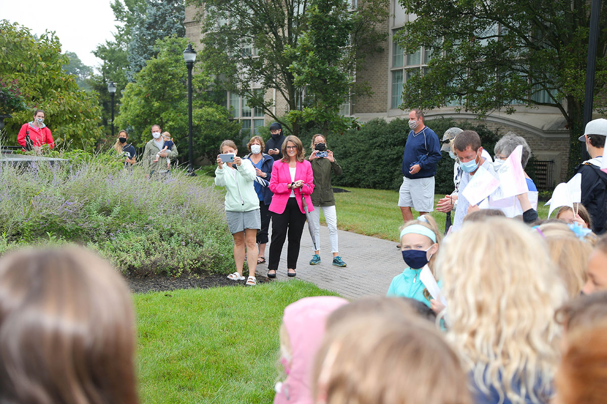 Xavier Montessori Lab School students sing to President Hanycz.